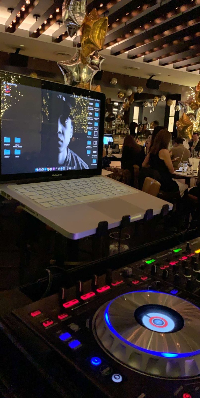 Pioneer controller and laptop in the booth mid-set