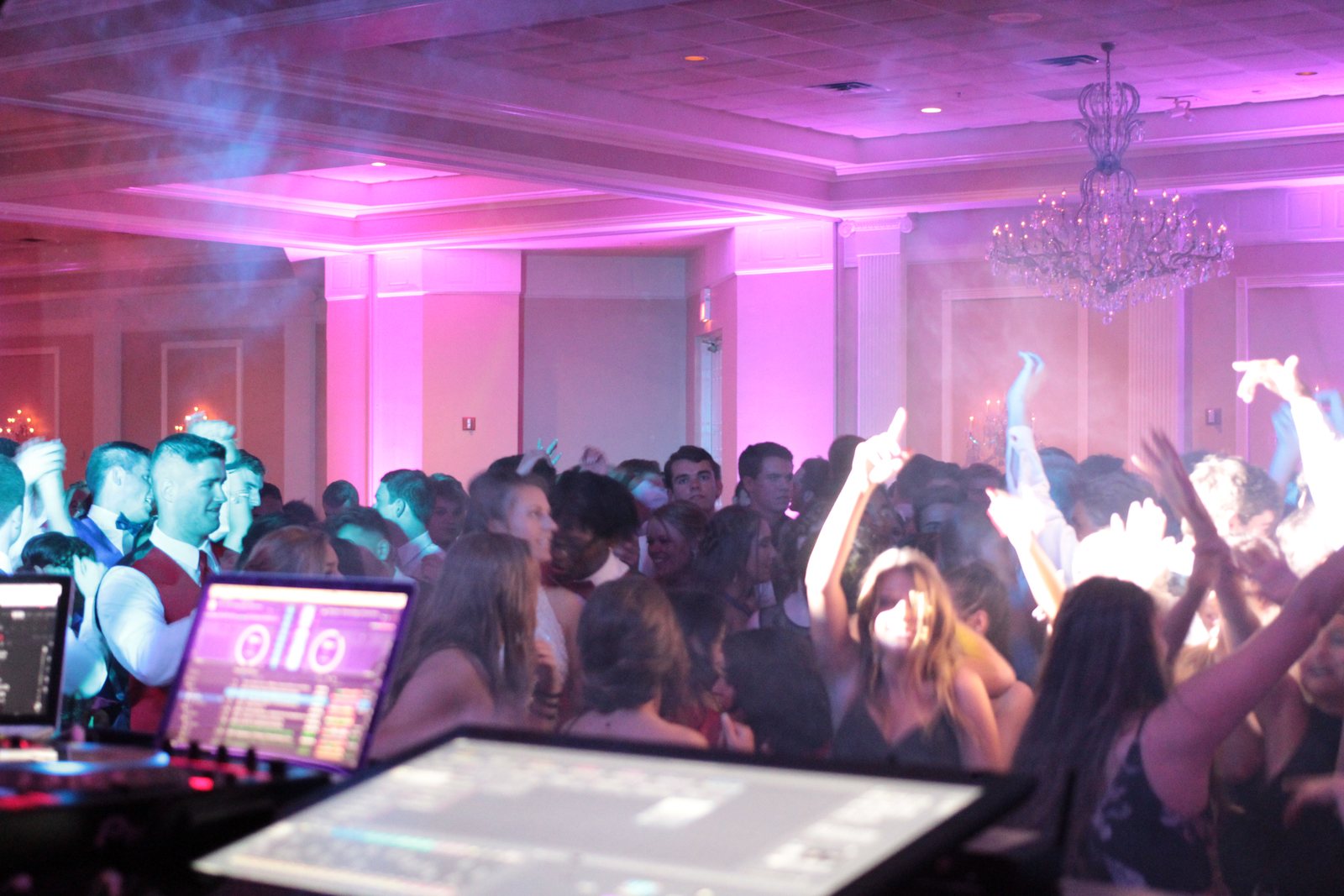 Packed dance floor at peak, shot from the DJ booth